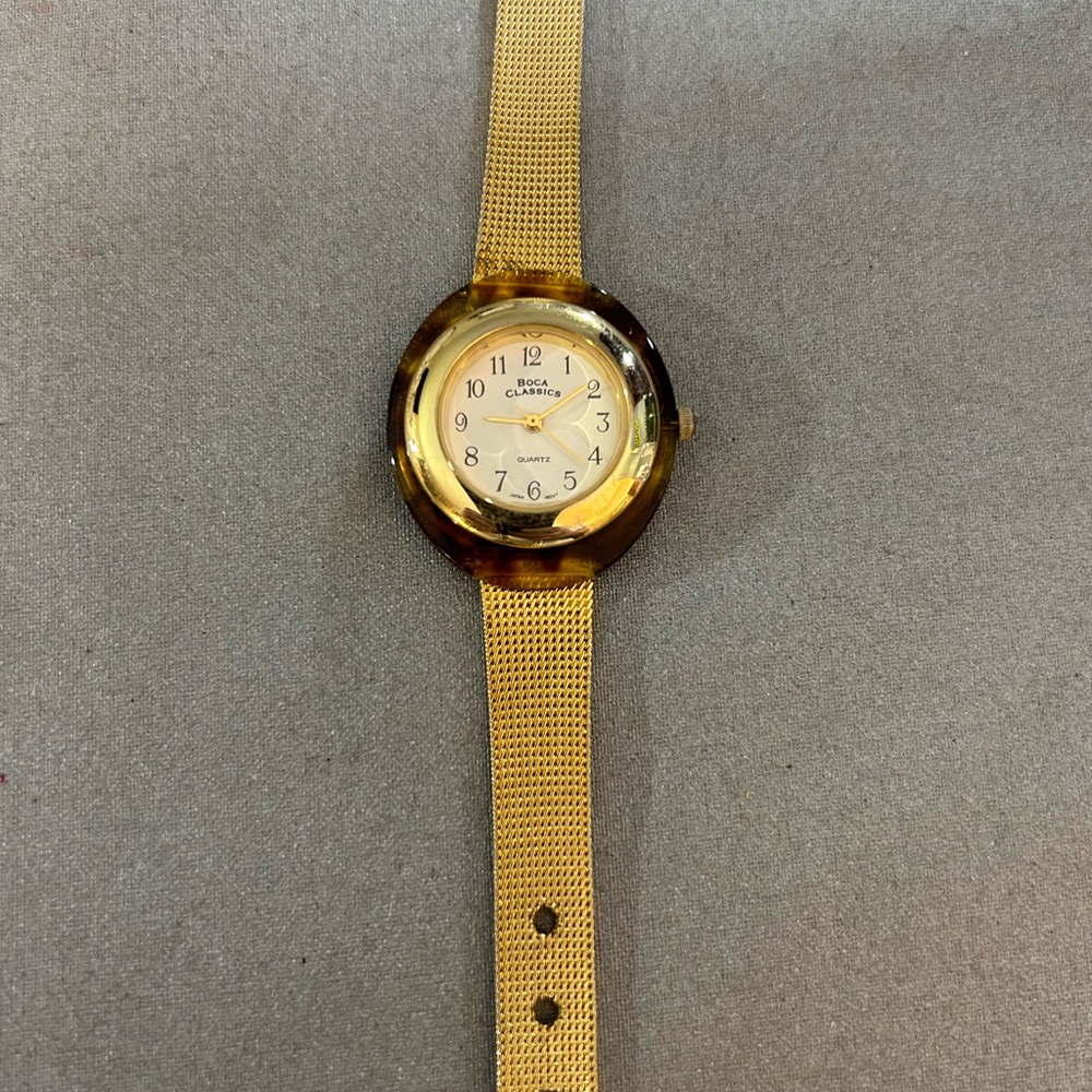 Gorgeous brown tortoise shell surrounded watch.
